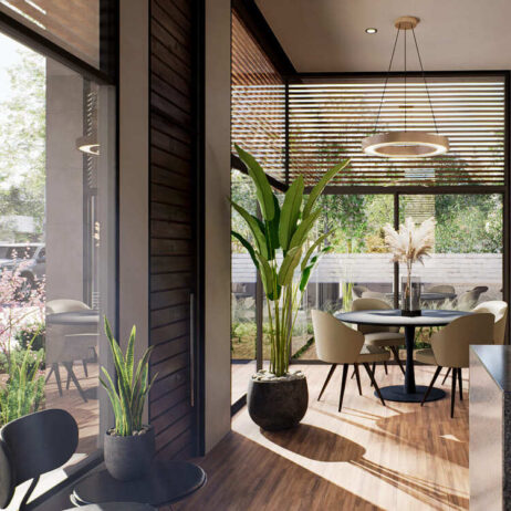 Área de comedor de los [Planos de Casa pequeña Mía] con mesa redonda y sillas modernas. Un gran ventanal corredizo de piso a techo conecta el espacio interior con el jardín. La habitación tiene piso de madera y una persiana de lamas horizontales.