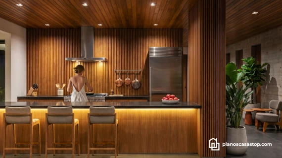 Cocina con revestimiento de madera y barra elegante, parte de los planos de casa moderna Viesca con iluminación cálida.