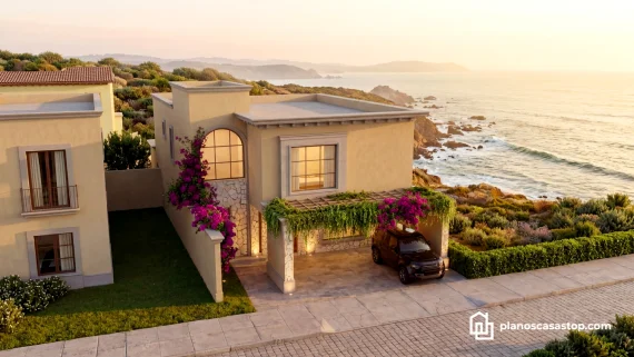 Fachada de casa colonial frente al mar con bugambilias, inspirada en los Planos de casa colonial Sauce con acabados rústicos.