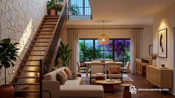 Vista interior de los Planos de casa colonial Sauce con escalera de madera, muro de piedra y ventanales al jardín.